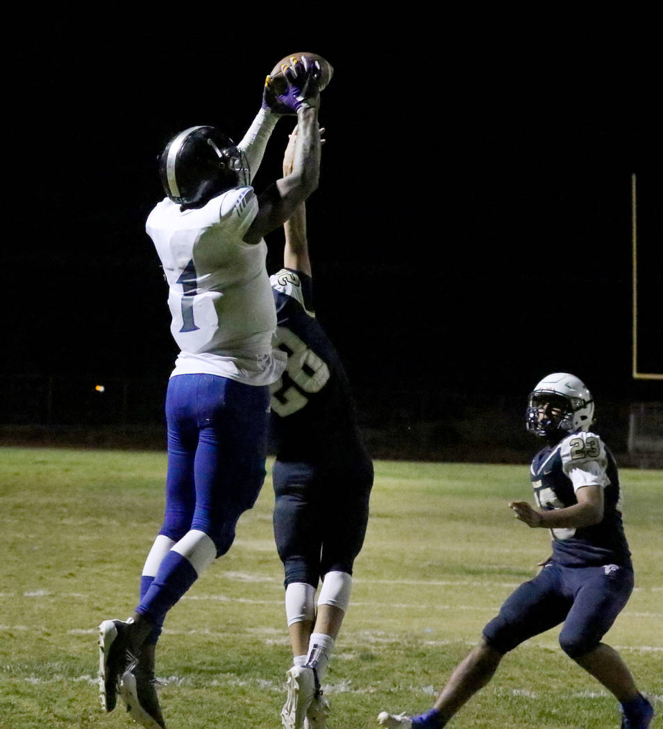 Desert Pines High's wide receiver Darnell Washington (1) jumps over Foothill High's corner ...