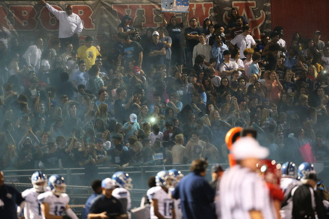Centennial students after releasing a blue smoke during a football game against Arbor View at A ...