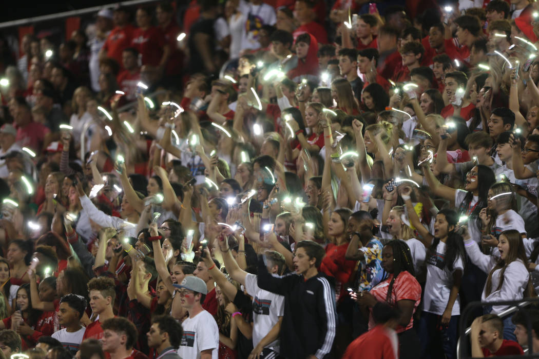 Arbor View students flash their lights during a football game against Centennial at Arbor View ...