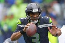 Seattle Seahawks quarterback Russell Wilson looks to pass against the New Orleans Saints during ...