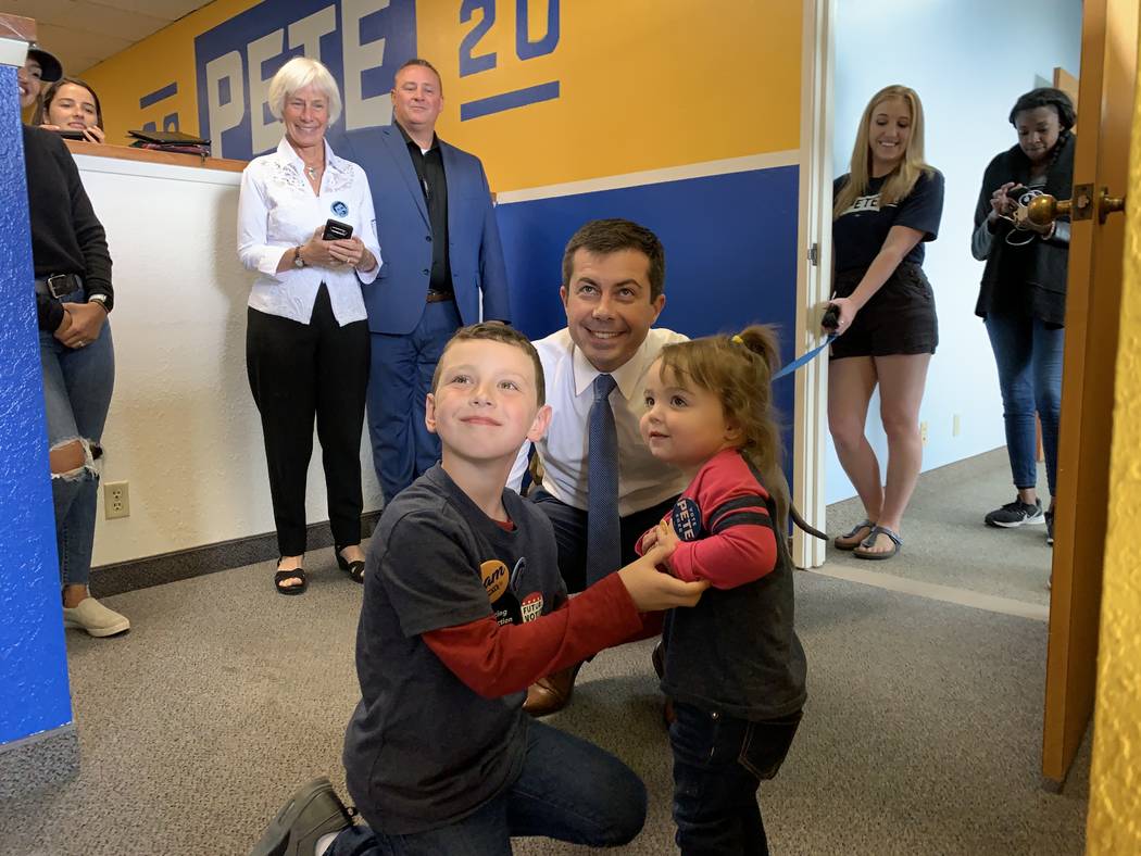 Democratic presidential candidate Pete Buttigieg poses for a photo with children of supporters ...
