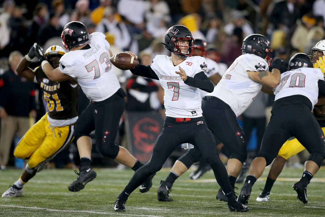 UNLV quarterback Kenyon Oblad throws a pass during the Mountain West game against the Universit ...