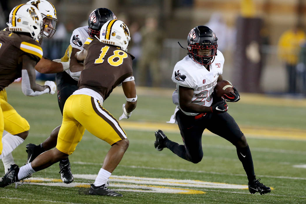 UNLV running back Courtney Reese tries to turn the corner while running during the Mountain Wes ...