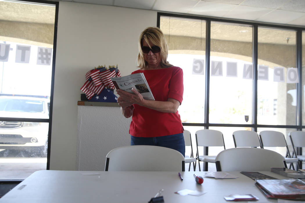 Linda Cannon, vice chair of the Clark County Republican Party, organizes pamphlets after a brea ...