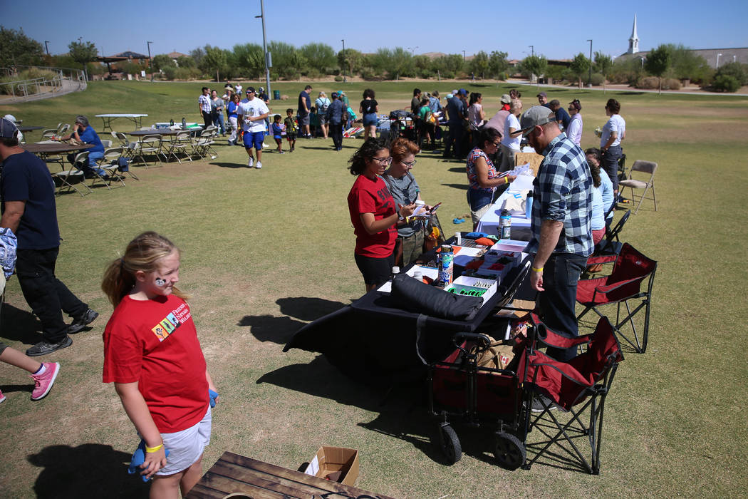 People attend a celebration of the 3rd annual Public Lands Day at Mountains Edge Regional Park ...