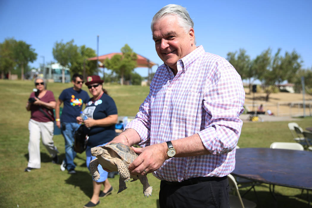 Gov. Steve Sisolak holds a turtoise during a celebration of the 3rd annual Public Lands Day at ...