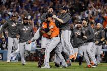 The Houston Astros celebrate after Game 7 of baseball's World Series against the Los Angeles Do ...
