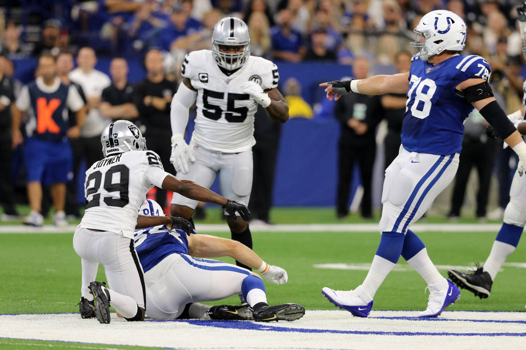 Indianapolis Colts center Ryan Kelly (78) points to Oakland Raiders outside linebacker Vontaze ...