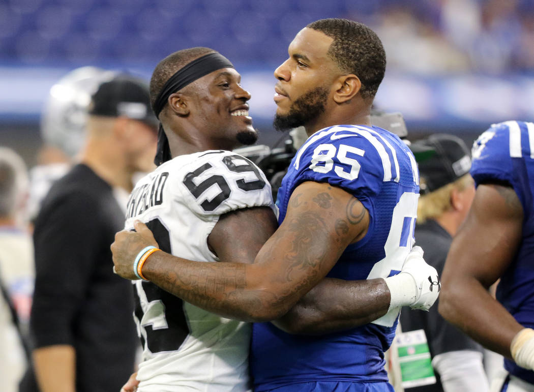 Oakland Raiders outside linebacker Tahir Whitehead (59) and Indianapolis Colts tight end Eric E ...