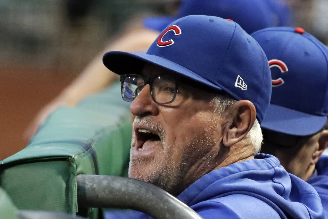 Chicago Cubs manager Joe Maddon yells from the dugout before the team's baseball game against t ...