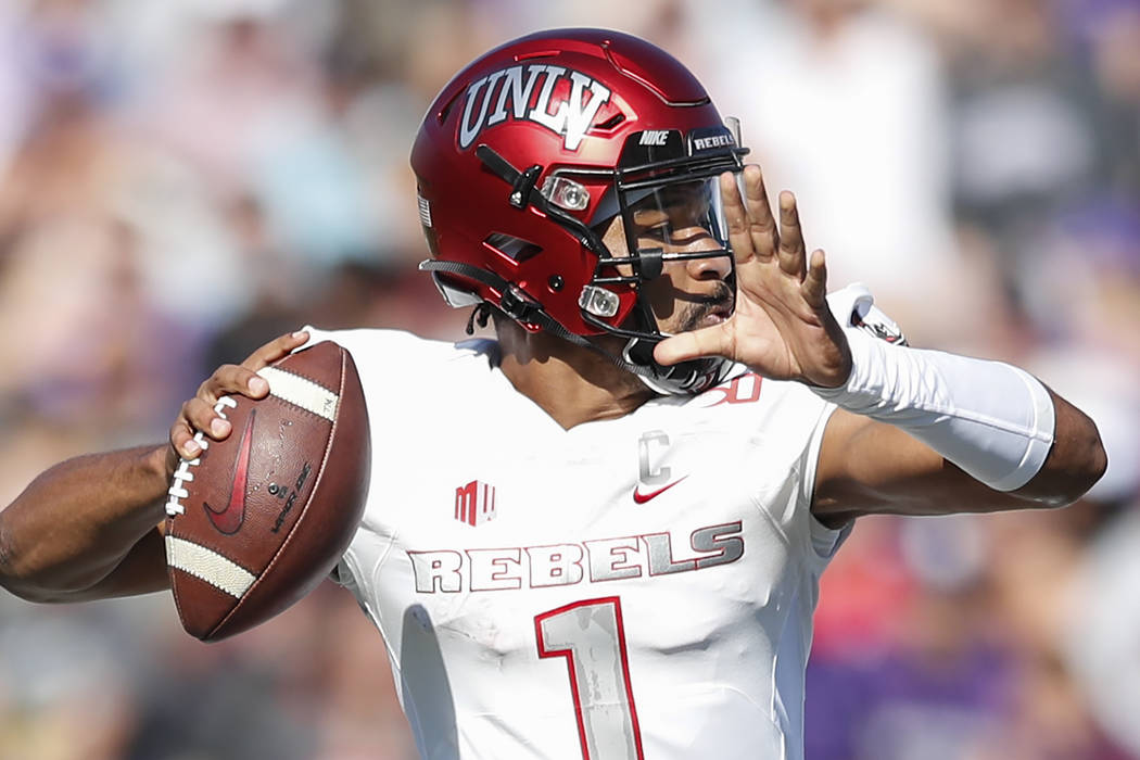 UNLV Rebels quarterback Armani Rogers looks to pass the ball against the Northwestern Wildcats ...