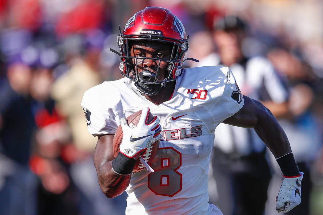 UNLV Rebels running back Charles Williams runs to score a touchdown against the Northwestern Wi ...