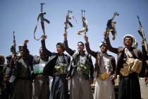 FILE - In this Sept. 21, 2019 file photo, Shiite Houthi tribesmen hold their weapons as they ch ...