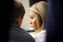 Former Dallas police officer Amber Guyger listens to her attorney Toby Shook during her trial a ...