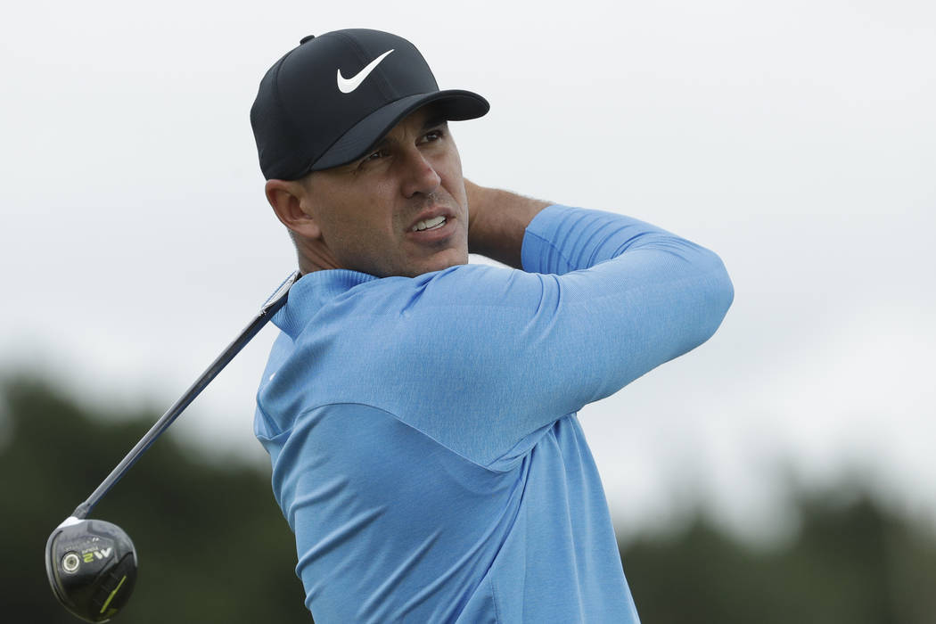 Brooks Koepka of the United States plays his tee shot on the 12th hole during the third round o ...