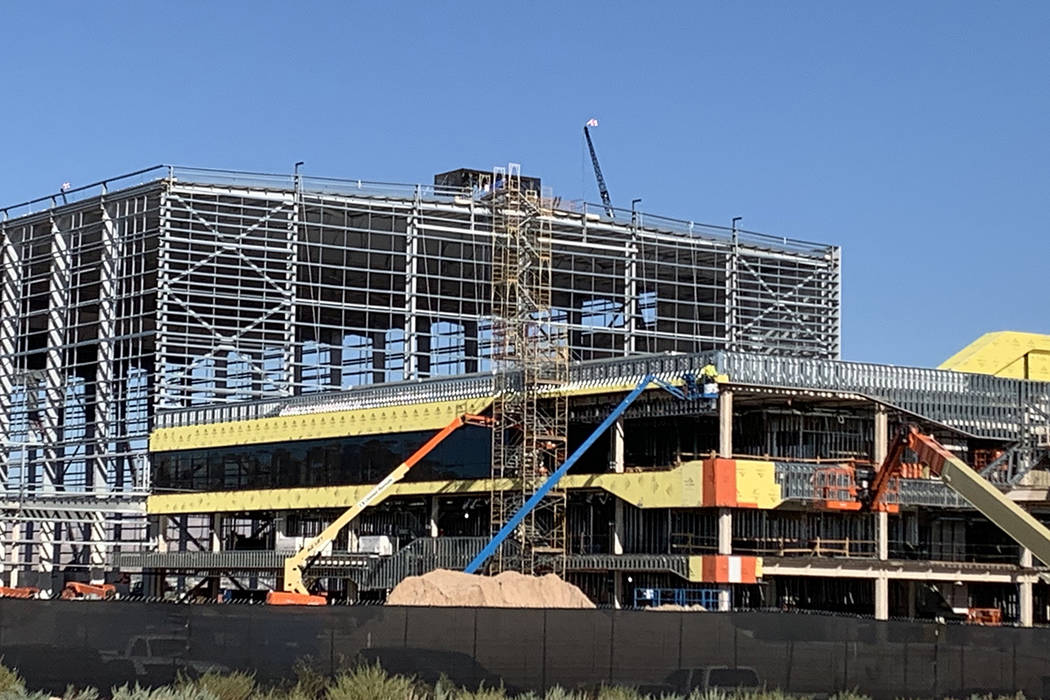 Glass installation progresses on the Raiders Henderson headquarters and practice facility, seen ...