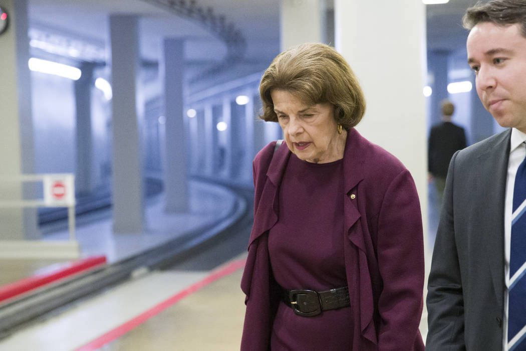 Sen. Dianne Feinstein, D-Calif., left, heads to the Senate for a vote, on Capitol Hill, Tuesday ...
