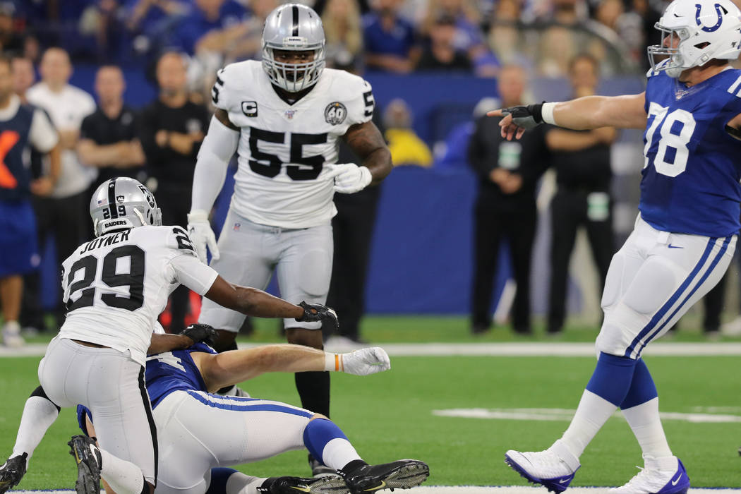 Indianapolis Colts center Ryan Kelly (78) points at Oakland Raiders outside linebacker Vontaze ...
