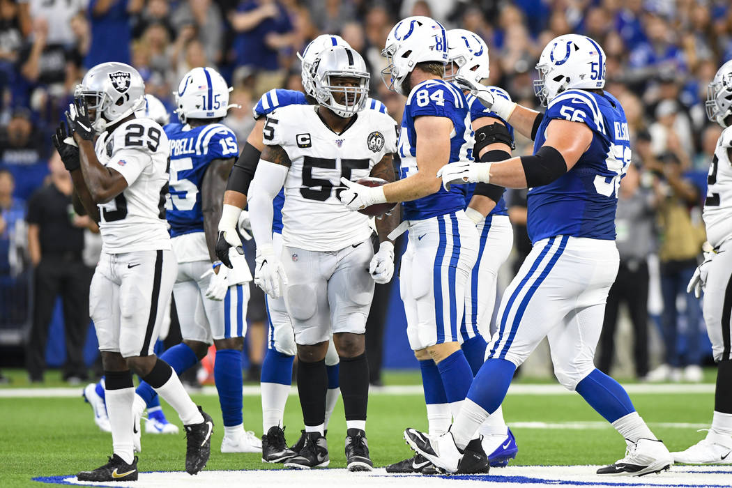 Oakland Raiders outside linebacker Vontaze Burfict (55) speaks with Indianapolis Colts tight en ...