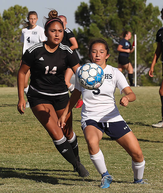 Centennial High School's Viviana Cera (5) pushes past a Palo Verde High School player during a ...