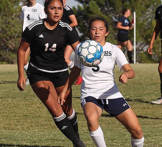 Centennial High School's Viviana Cera (5) pushes past a Palo Verde High School player during a ...