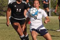 Centennial High School's Viviana Cera (5) pushes past a Palo Verde High School player during a ...