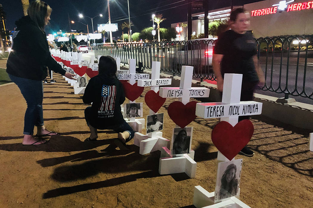 People visit the "Welcome to Fabulous Las Vegas" sign on Monday, Sept. 30, 2019, where crosses ...