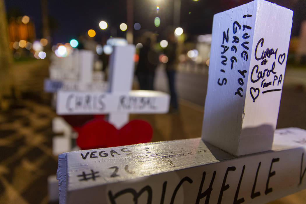 Message on a cross to Greg Zanis who placed 58 crosses near the "Welcome to Fabulous Las Vegas" ...