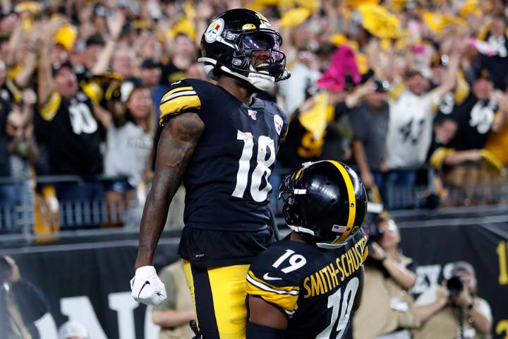 Pittsburgh Steelers wide receiver Diontae Johnson (18) celebrates with JuJu Smith-Schuster (19) ...