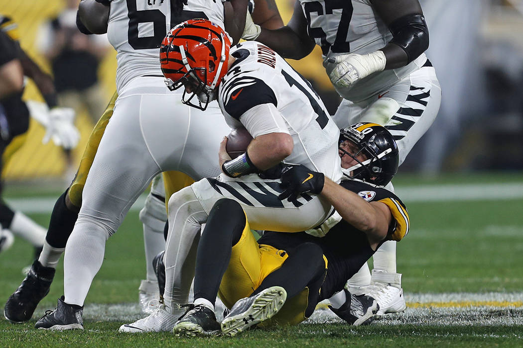 Pittsburgh Steelers outside linebacker T.J. Watt (90) sacks Cincinnati Bengals quarterback Andy ...