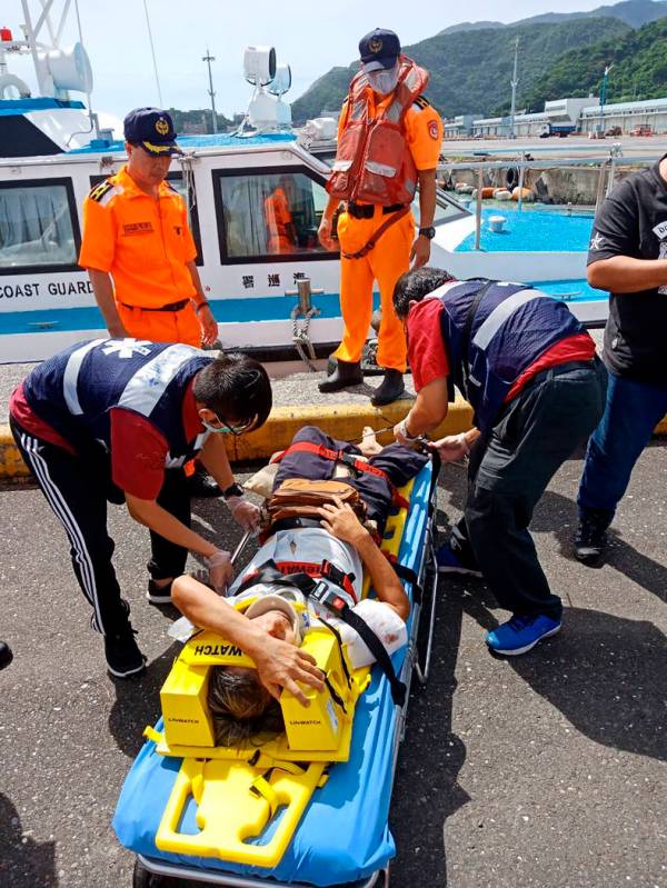 An injured people lies on stretcher at the site of a collapsed bridge in Nanfangao, eastern Tai ...