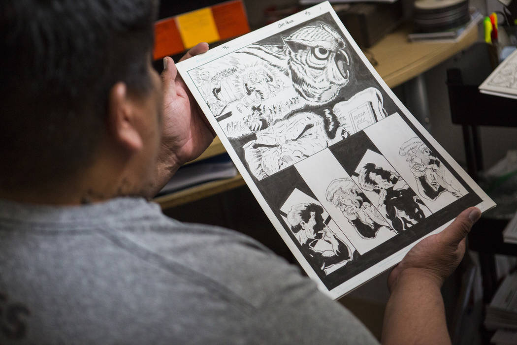 Theo Tso, creator of Captain Paiute, shows a page for an upcoming issue at his home in Las Vega ...