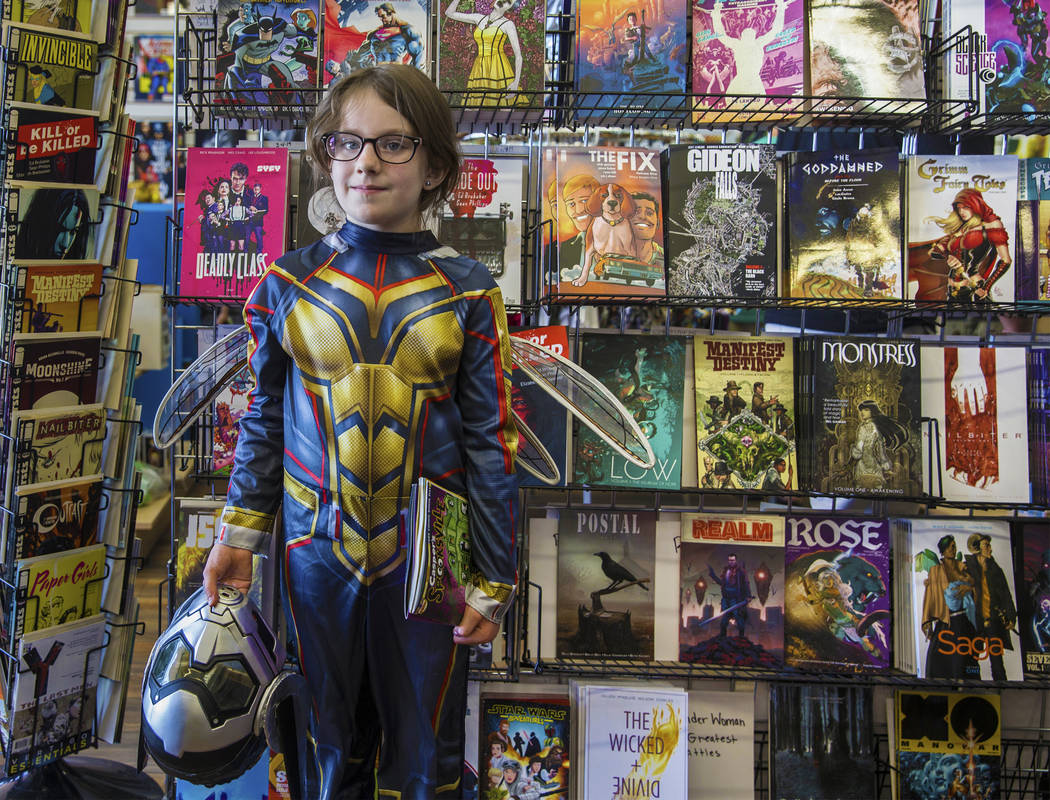 Emma Lee, 8, dressed as The Wasp, during free comic book day at Cosmic Comics on Saturday, May, ...