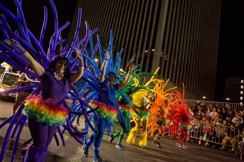 Parade participants make their way down 4th Street during the 19th annual PRIDE Night Parade do ...