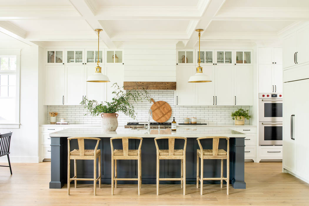 The kitchen is the hub of the house where people congregate. An interactive island provides a p ...