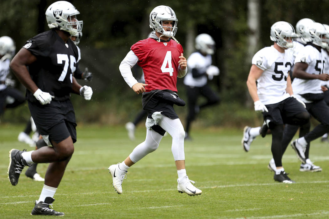 Oakland Raiders quarterback Derek Carr attends a training session during the media day at The G ...