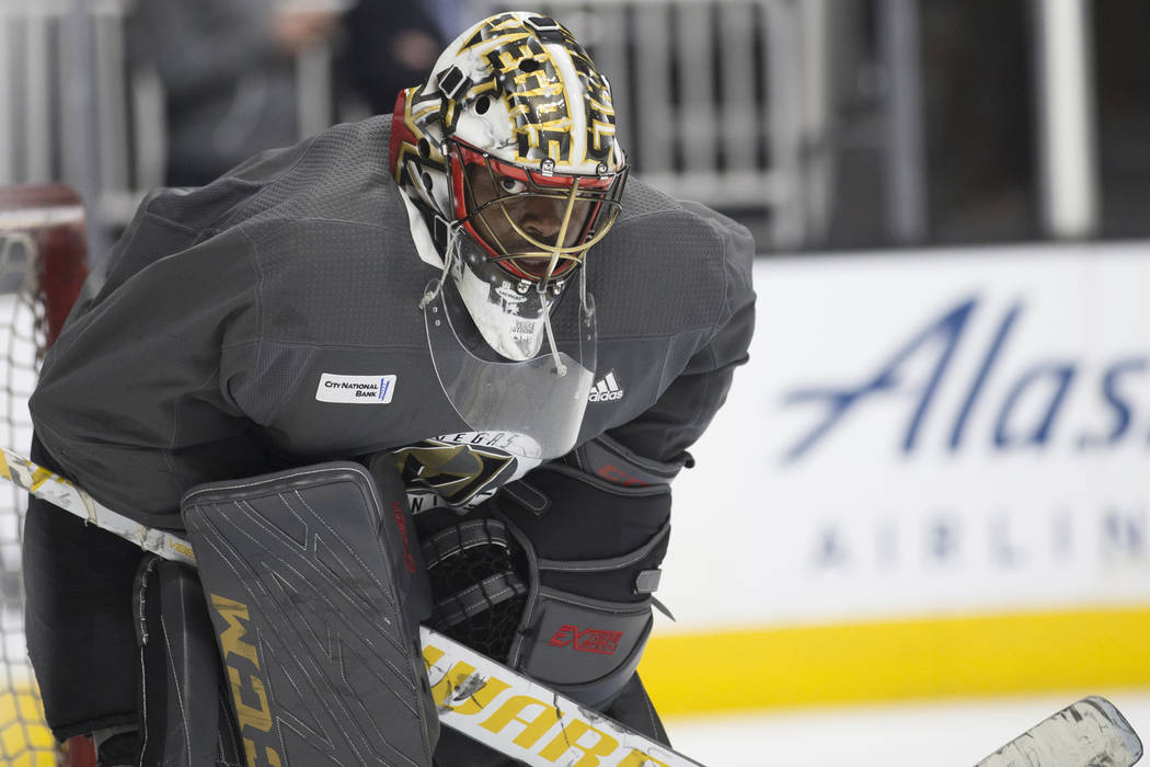 Golden Knights goaltender Malcolm Subban (30) peers out of his mask during practice on Thursday ...