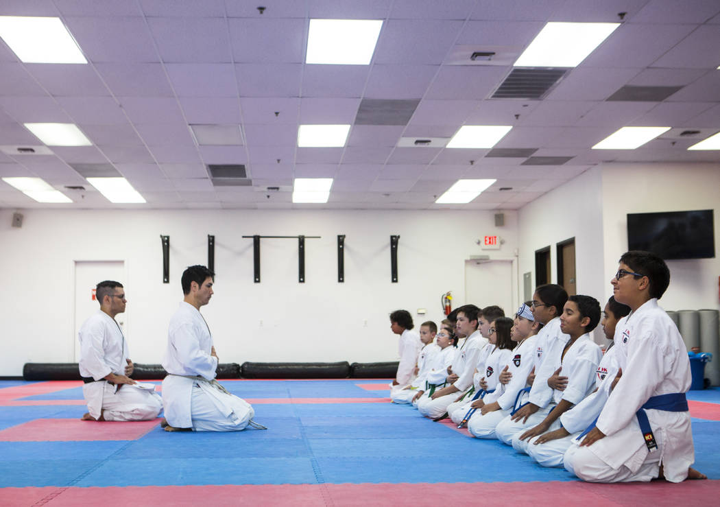 Hiroshi Allen leads students in a breathing technique during a class at Hiro Karate in Las Vega ...