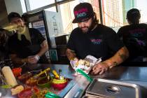 Graffiti Bao and Pina Nachos owner and chef Marc Marrone prepares nachos before the start of a ...