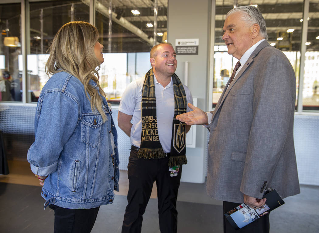 Gov. Steve Sisolak, right, chats with Todd Pollock and his daughter Carley as the Vegas Golden ...