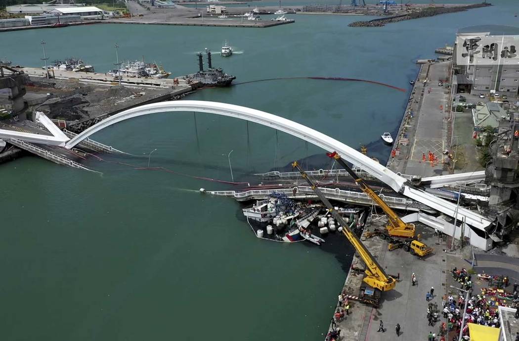 This image made from video provided by Taiwan's Military News Agency shows Nanfangao Bridge, co ...