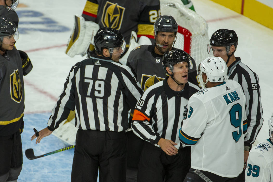San Jose Sharks left wing Evander Kane (9) argues with a referee after fighting with Vegas Gold ...