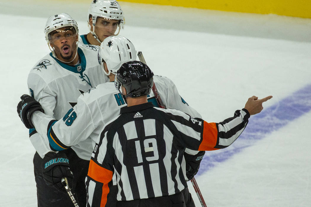 San Jose Sharks left wing Evander Kane (9) is thrown out of the game by a referee after fightin ...