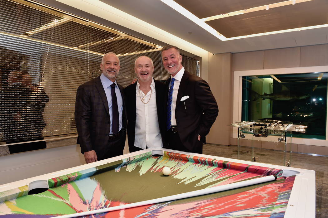 Lorenzo Fertitta, artist Damien Hirst and Frank Fertitta III are shown at Empathy Suite's openi ...