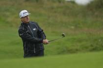 Charley Hoffman of the United States plays onto the 15th green during a practice round ahead of ...