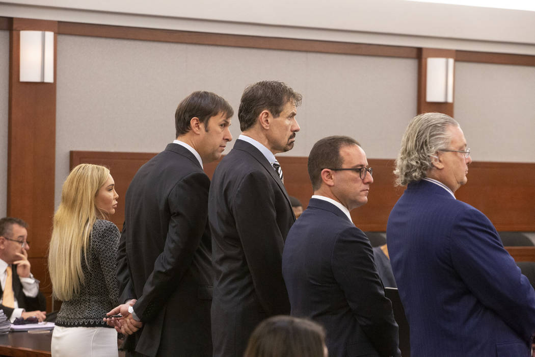 From left, Ashley Fargo, defense attorney David Brown, Henry Nicholas III and attorneys Richard ...