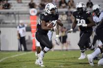 Central Florida running back Trillion Coles (33) rushes for yardage during the second half of a ...