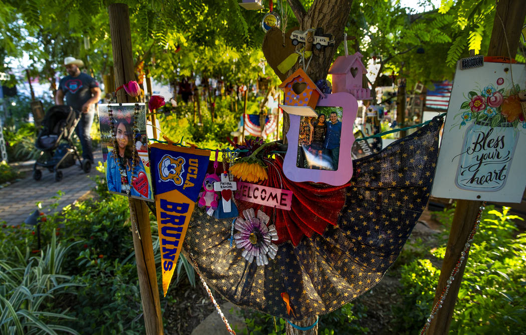 The decorated tree for Melissa Ramirez greets visitors including survivor Gerald Crisp who walk ...