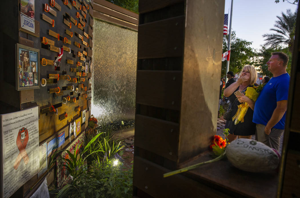 Char Teegarden, left, and husband Kurtiss pause at a remembrance wall at the Las Vegas Healing ...