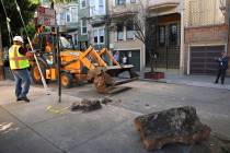 In this Monday, Sept. 30, 2019, photo, a San Francisco Public Works crew removes boulders from ...